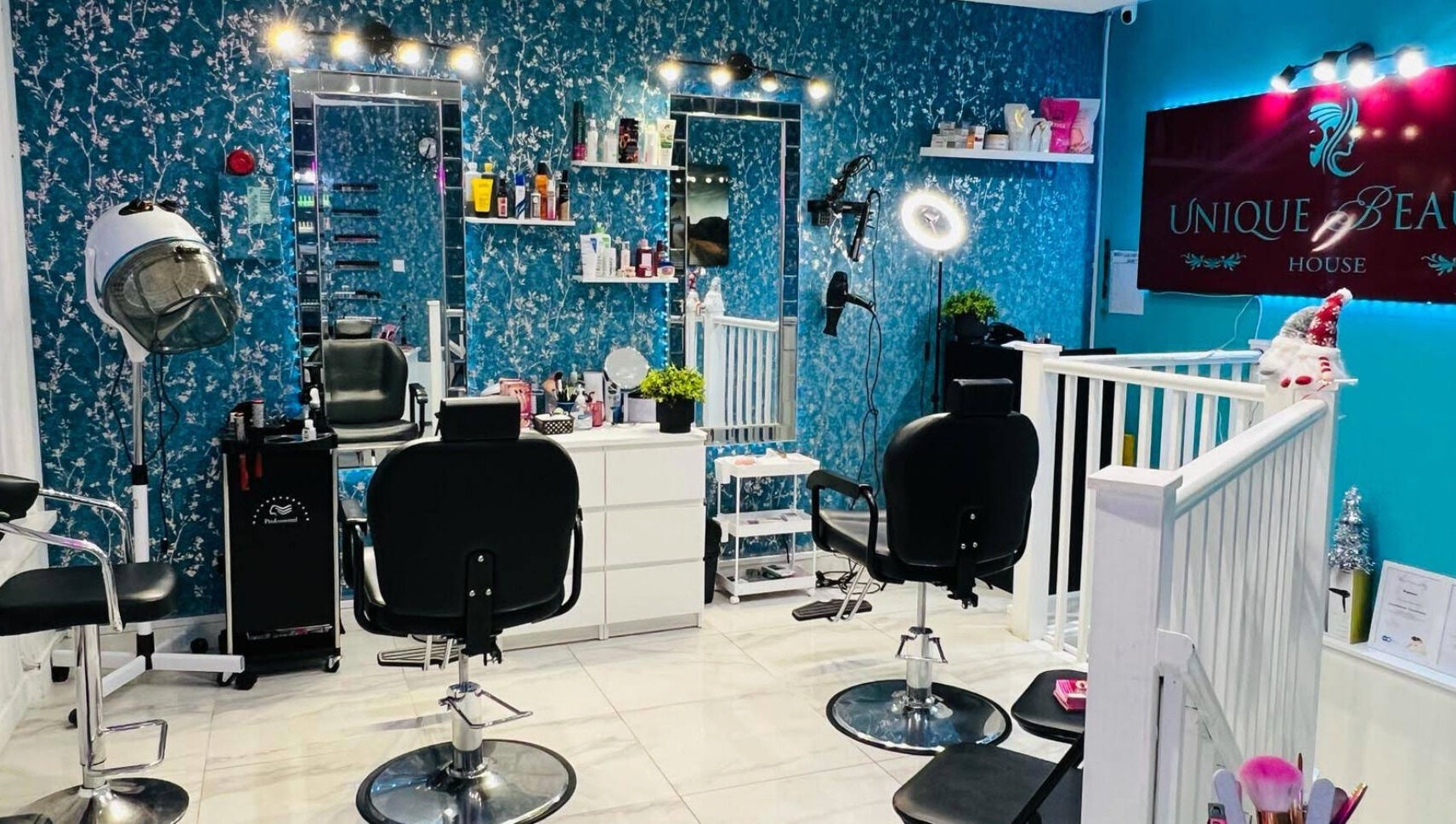 Interior of Unique Beauty House in Reading, England, GB, featuring stylish hair styling stations and decor.