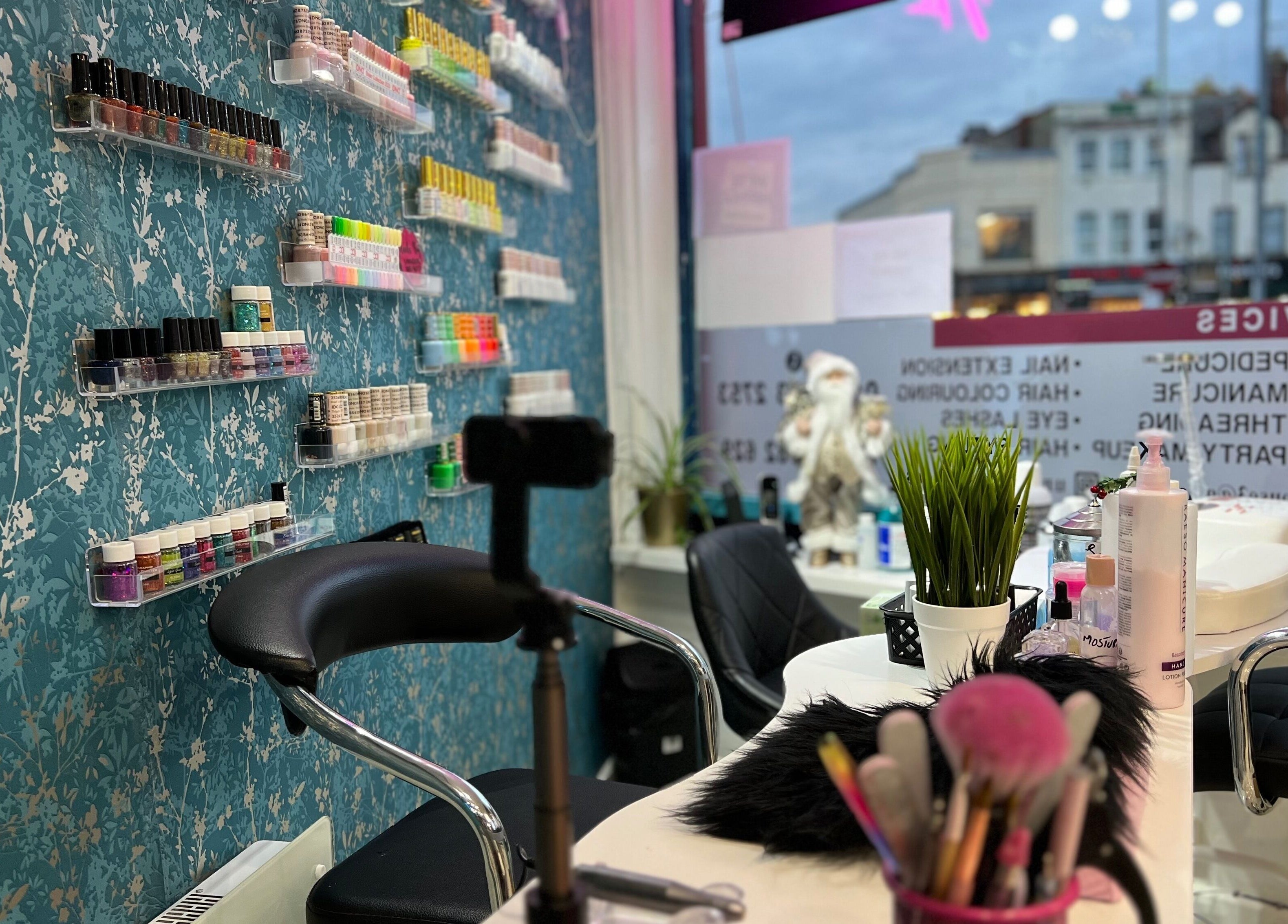 Nail station with colorful polishes at Unique Beauty House in Reading, England, GB.