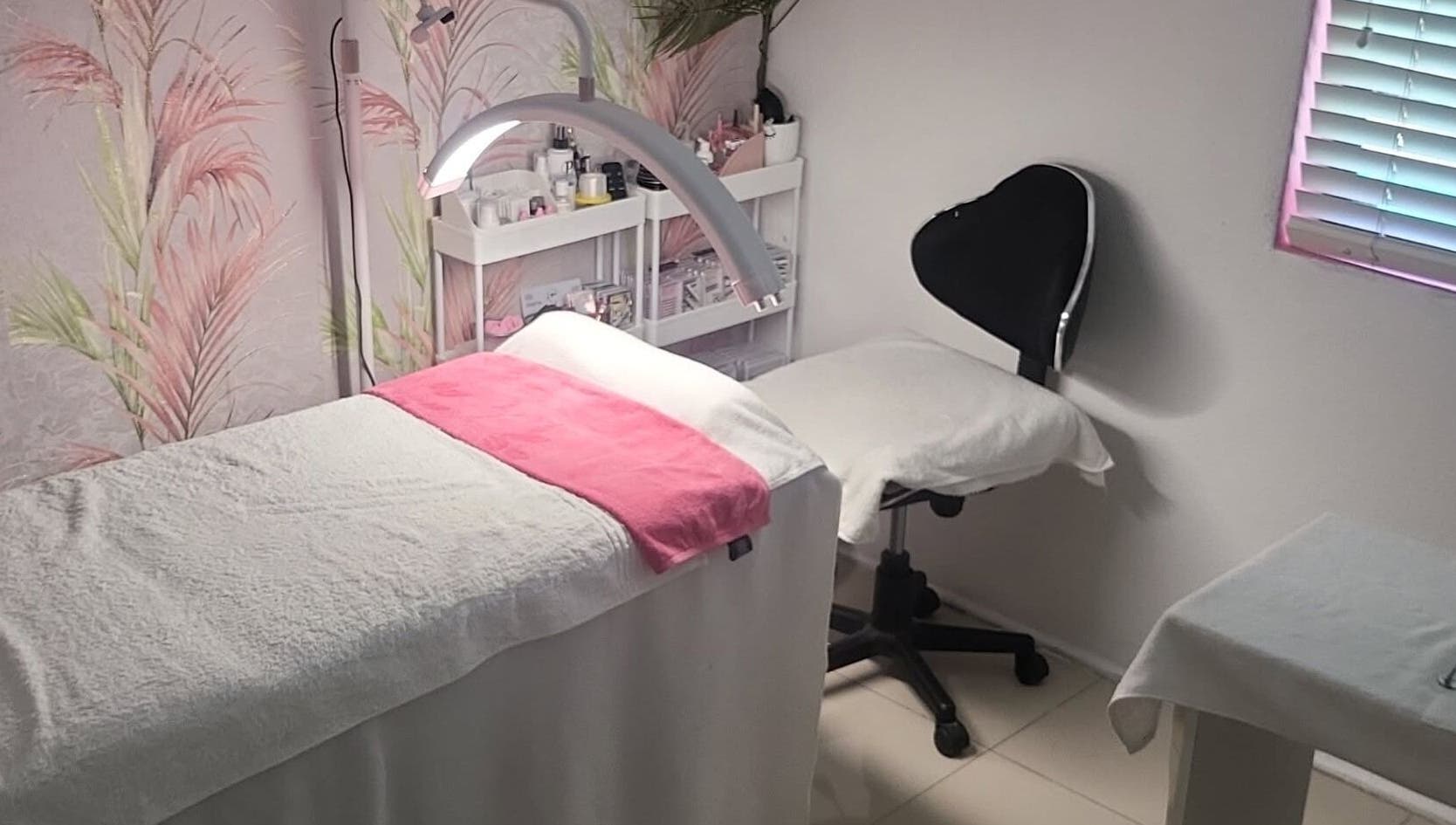 Relaxing therapy room at Touch of Chic, Cape Town, Western Cape, ZA, featuring cozy bed and ambient decor.