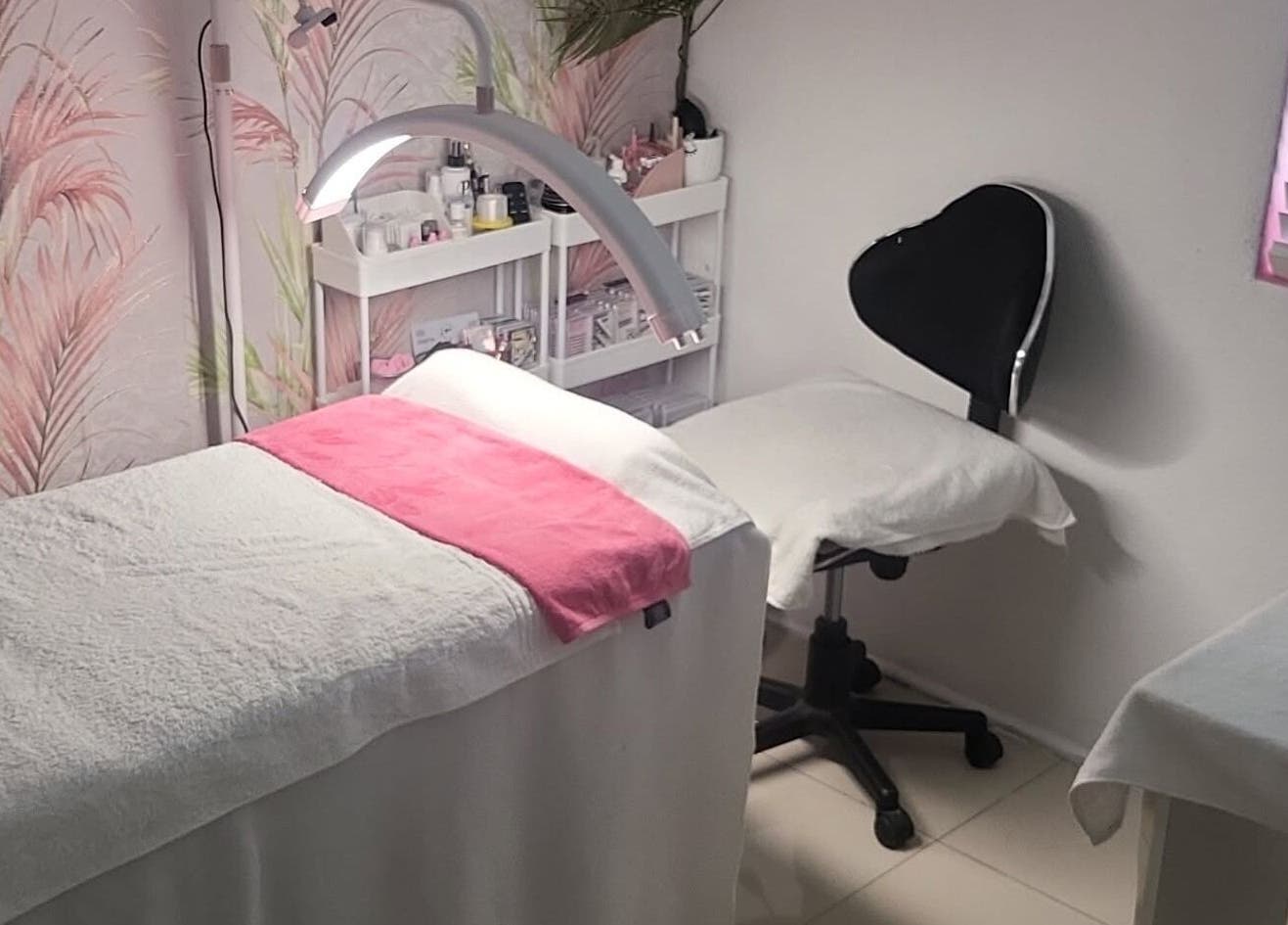 Relaxing therapy room at Touch of Chic, Cape Town, Western Cape, ZA, featuring cozy bed and ambient decor.