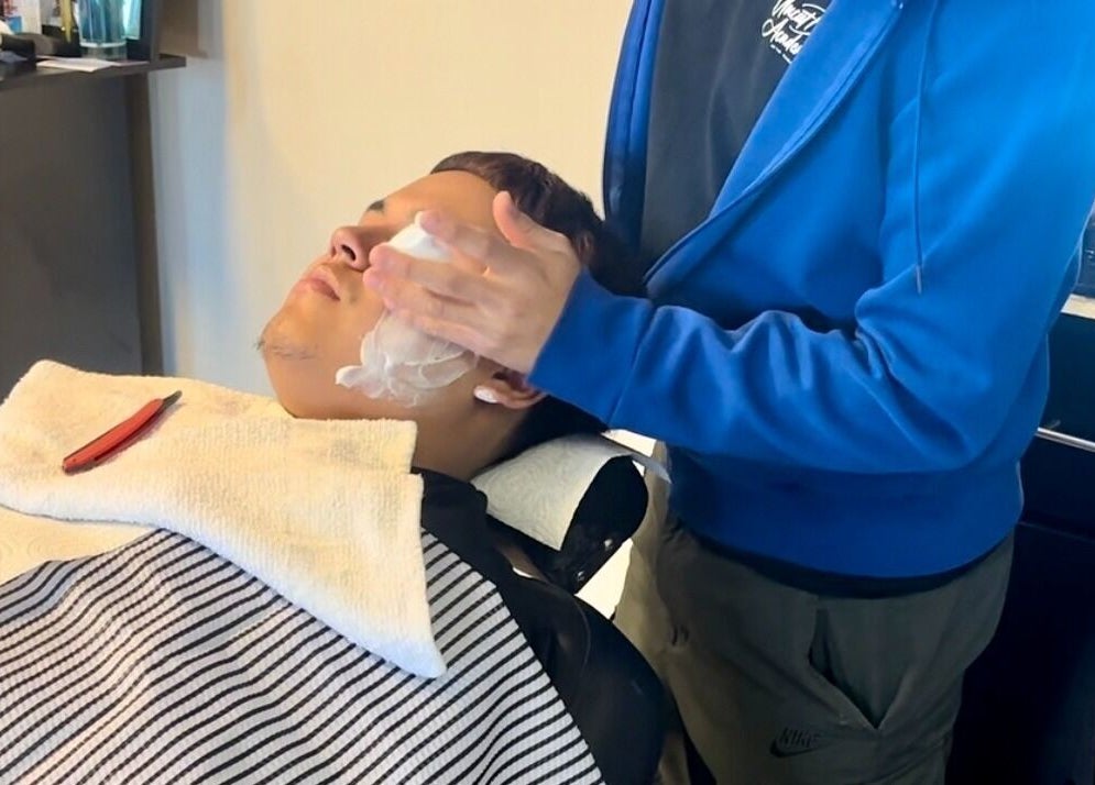 Gentle shave at Uncut Barber Academy in Savannah, Georgia, US. Experience premium grooming services.