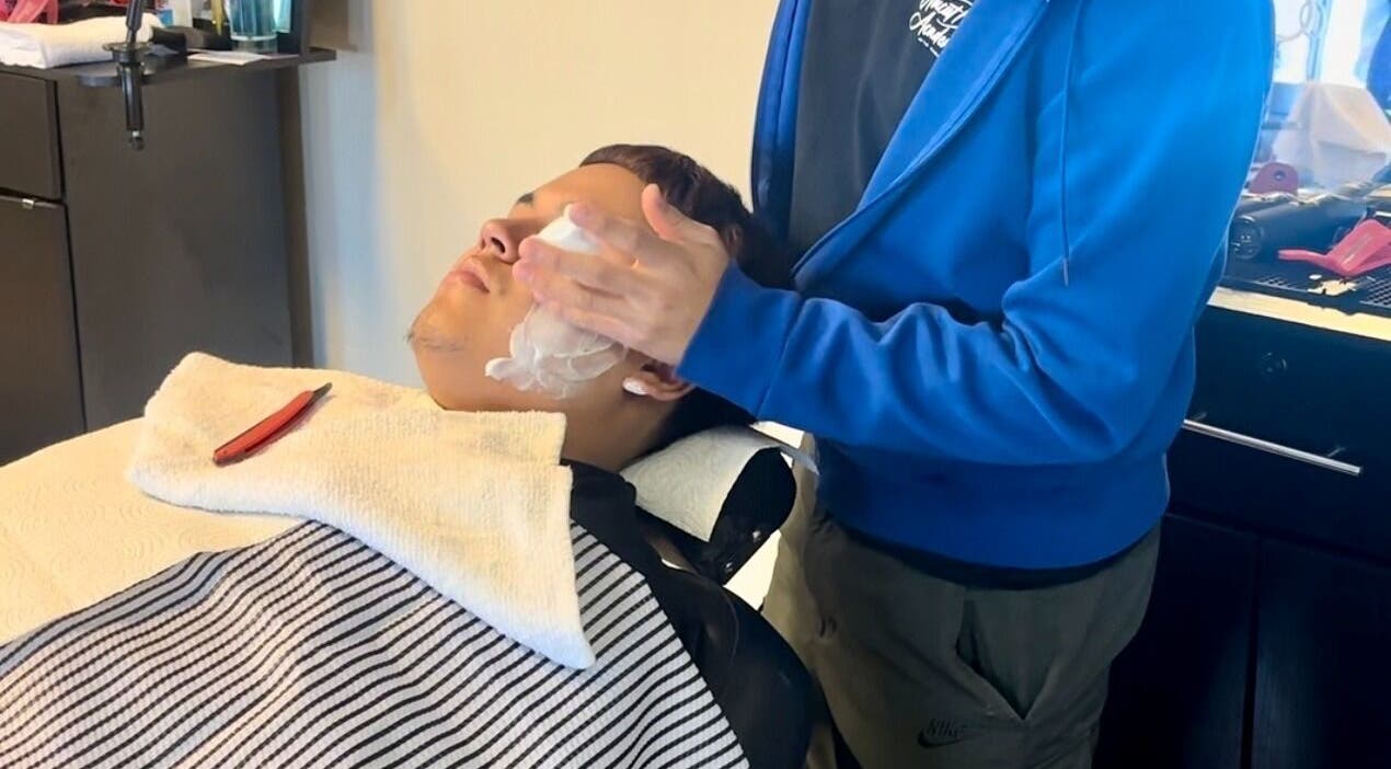 Gentle shave at Uncut Barber Academy in Savannah, Georgia, US. Experience premium grooming services.
