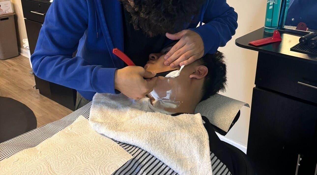 Close-up of a precision shave at Uncut Barber Academy in Savannah, Georgia, US.