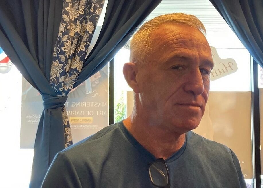 Customer at Uncut Barber Academy in Savannah, Georgia enjoying a fresh haircut in a stylish interior.