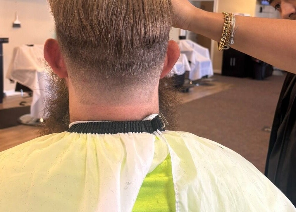 Expert barbering at Uncut Barber Academy in Savannah, Georgia, US. Experience precision cuts and styling.