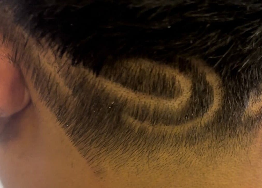 Detailed undercut design at Uncut Barber Academy in Savannah, Georgia, US, showcasing skilled barber artistry.