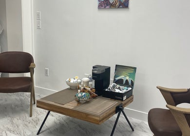 Relaxing seating area with coffee station at Dr. Ina Zhou's clinic, Coquitlam, British Columbia, CA.