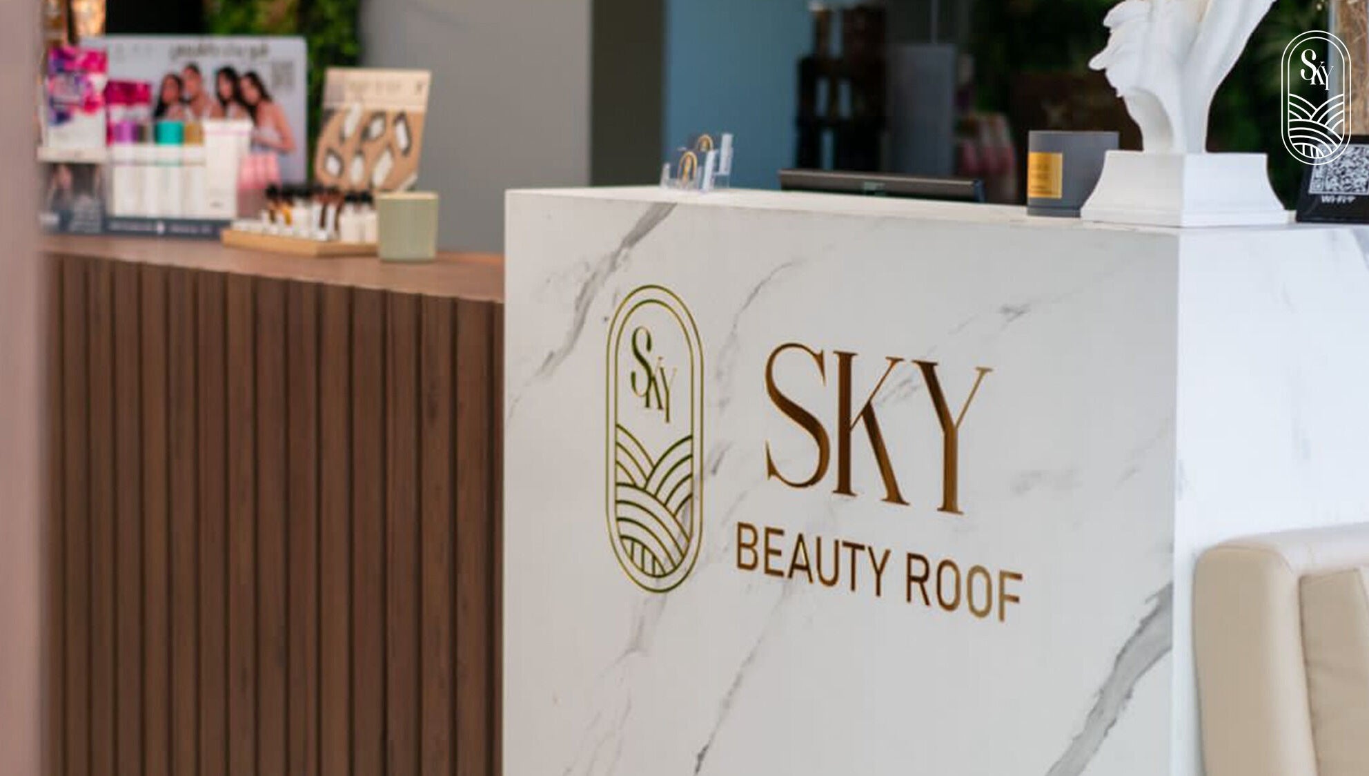 Reception desk at Sky Beauty Roof, Amman, JO with elegant branding and decor.