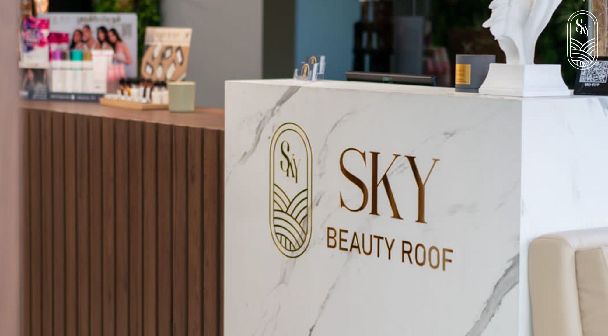 Reception desk at Sky Beauty Roof, Amman, JO with elegant branding and decor.