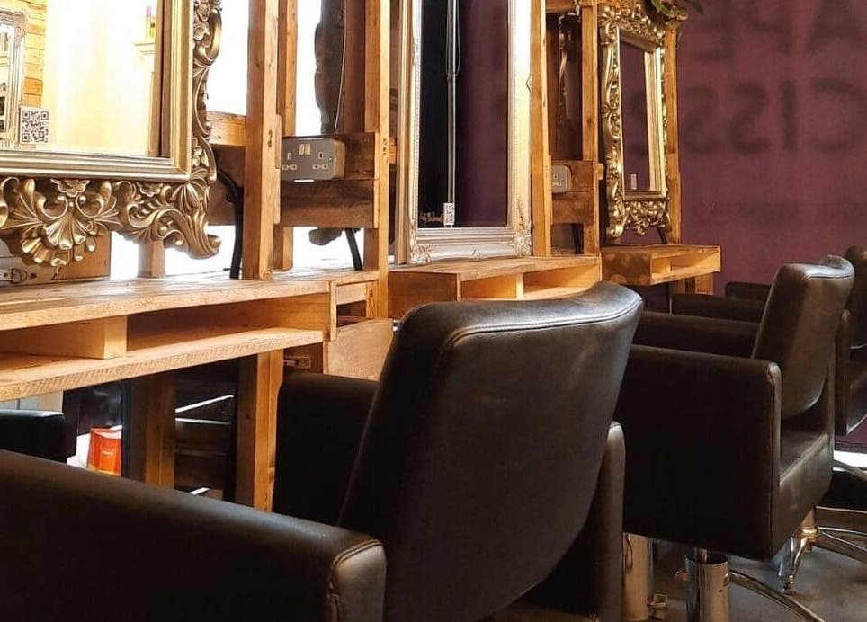 Chic styling chairs and ornate mirrors at Rock Paper Scissors Hair & Beauty Salon, Walmer, England, GB.