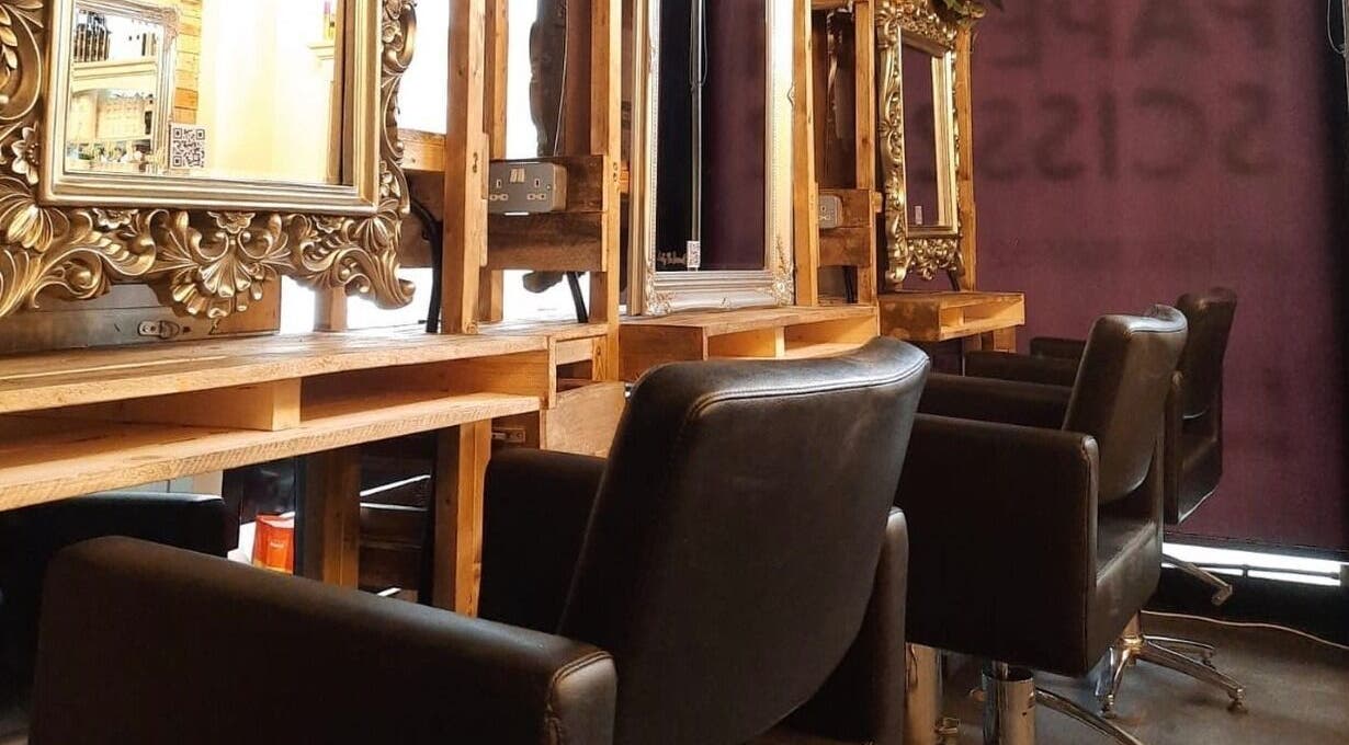 Chic styling chairs and ornate mirrors at Rock Paper Scissors Hair & Beauty Salon, Walmer, England, GB.
