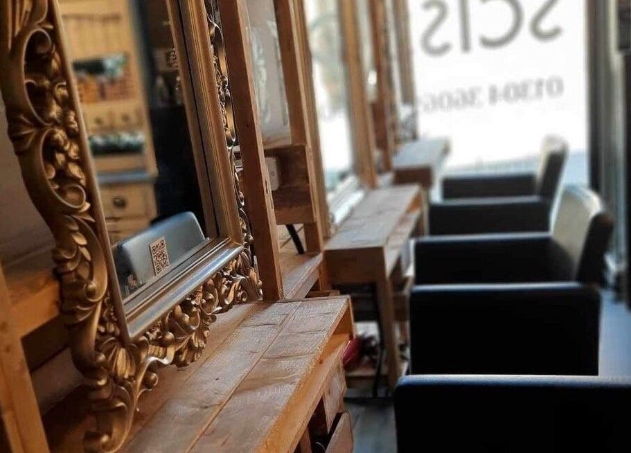 Elegant mirrored styling stations at Rock Paper Scissors Hair & Beauty Salon, Walmer, England, GB.