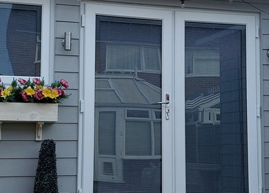 Charming entrance of Beauty Essence Salon in Chelmsford, England, GB, with vibrant floral displays.