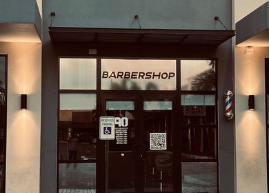 Exterior of Barbershop90 in Willemstad, Curaçao showcasing modern design and welcoming entrance.