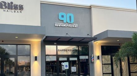 Front view of Barbershop90, a stylish barbershop in Willemstad, Curaçao, CW, with a sleek modern design.