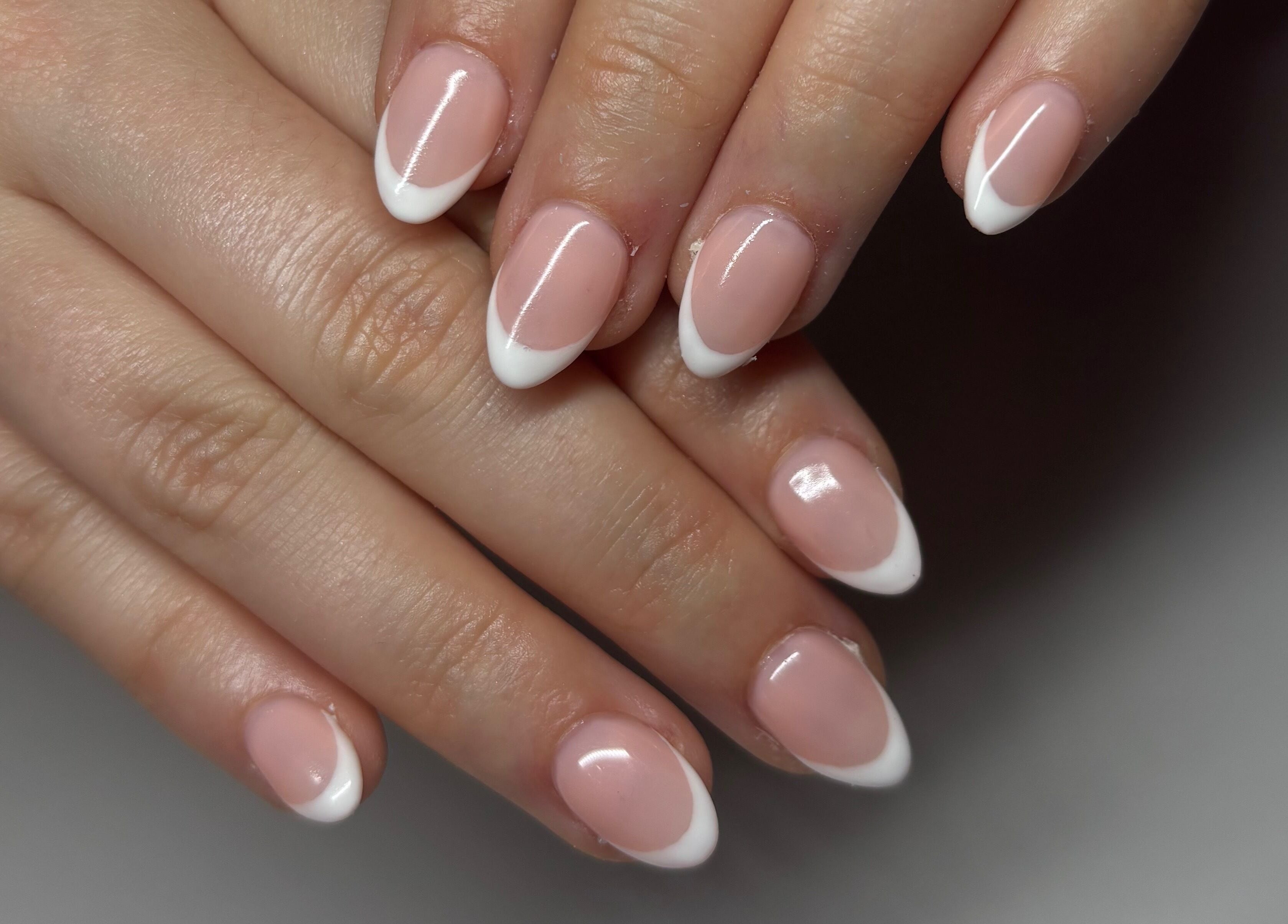 Elegant French manicure at Gwen’s Aesthetics, Pembroke, Ontario, CA. Perfectly shaped nails with white tips.
