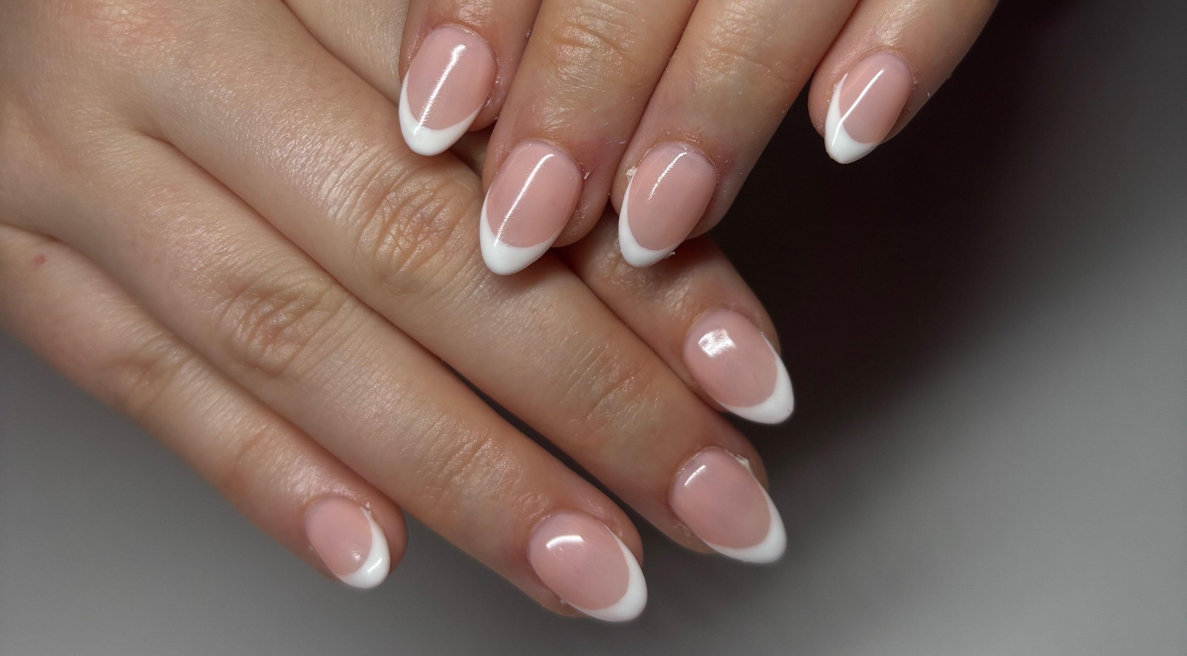 Elegant French manicure at Gwen’s Aesthetics, Pembroke, Ontario, CA. Perfectly shaped nails with white tips.