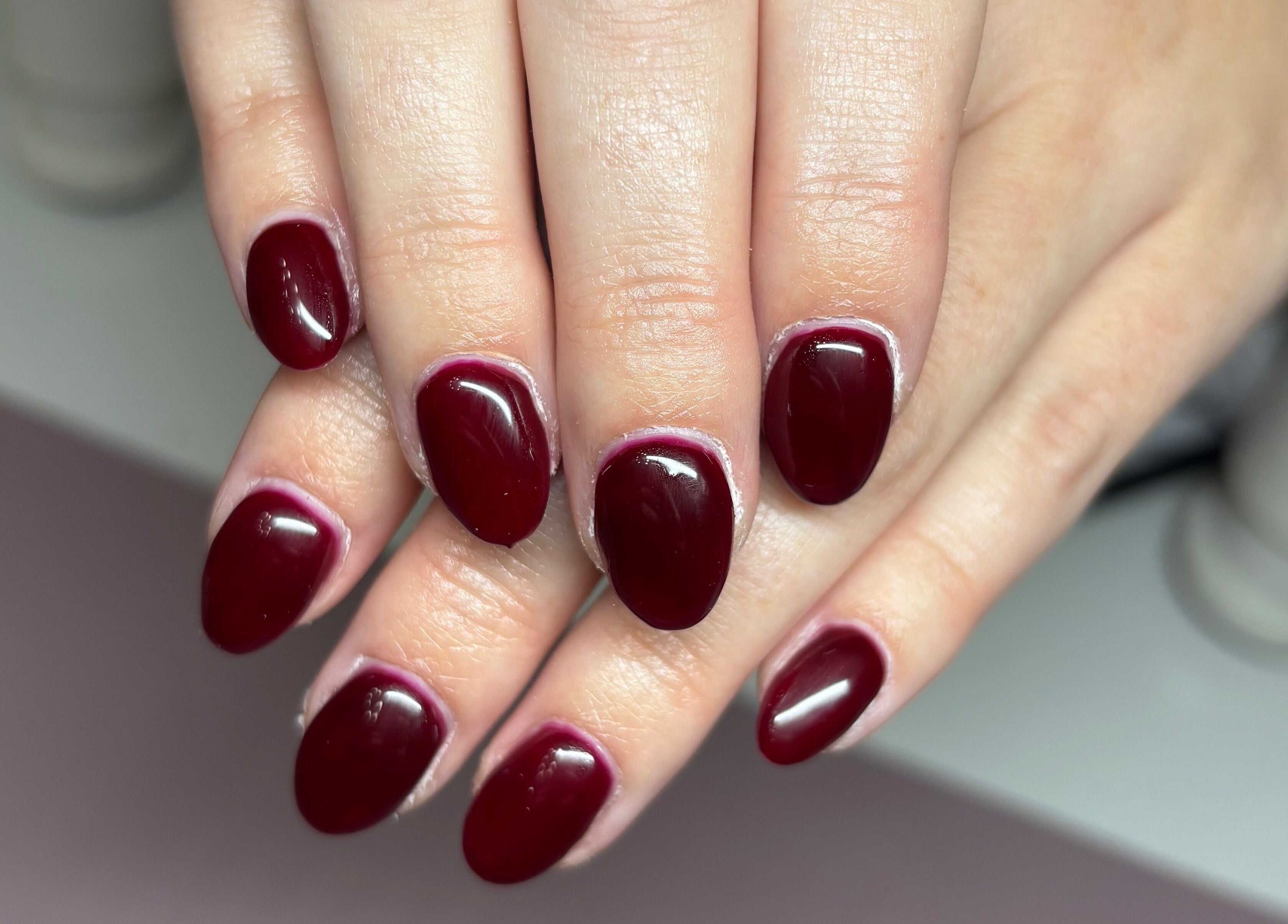 Elegant crimson manicure at Gwen’s Aesthetics, Pembroke, Ontario, CA. Perfect finish and vibrant color.