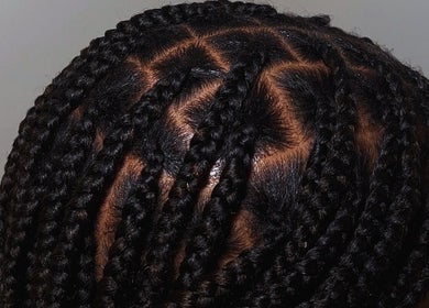 Intricate braided hairstyle at BeautyByFaves YYC in Calgary, Alberta, CA, showcasing expert hair styling.