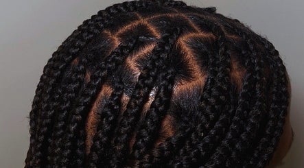 Intricate braided hairstyle at BeautyByFaves YYC in Calgary, Alberta, CA, showcasing expert hair styling.