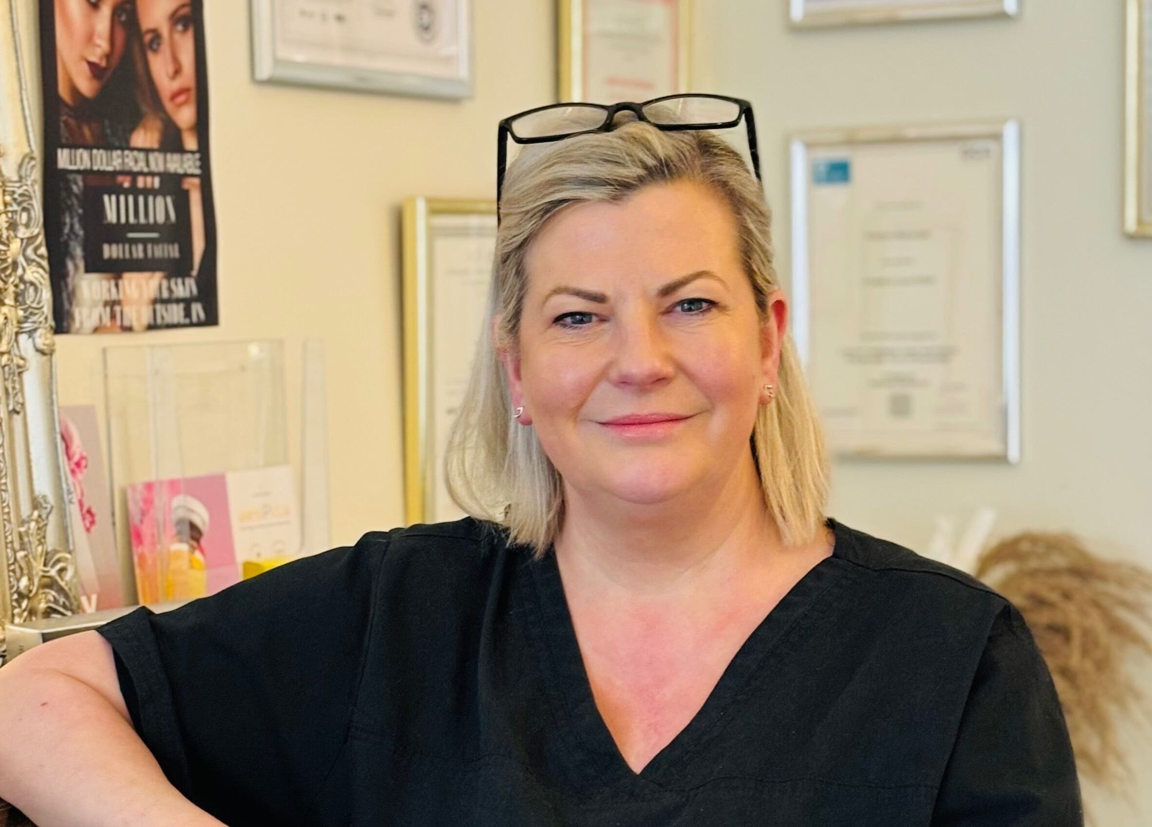 Professional at Fran Wainwright Beauty and Aesthetics in Annan, Scotland, GB with certificates in the background.