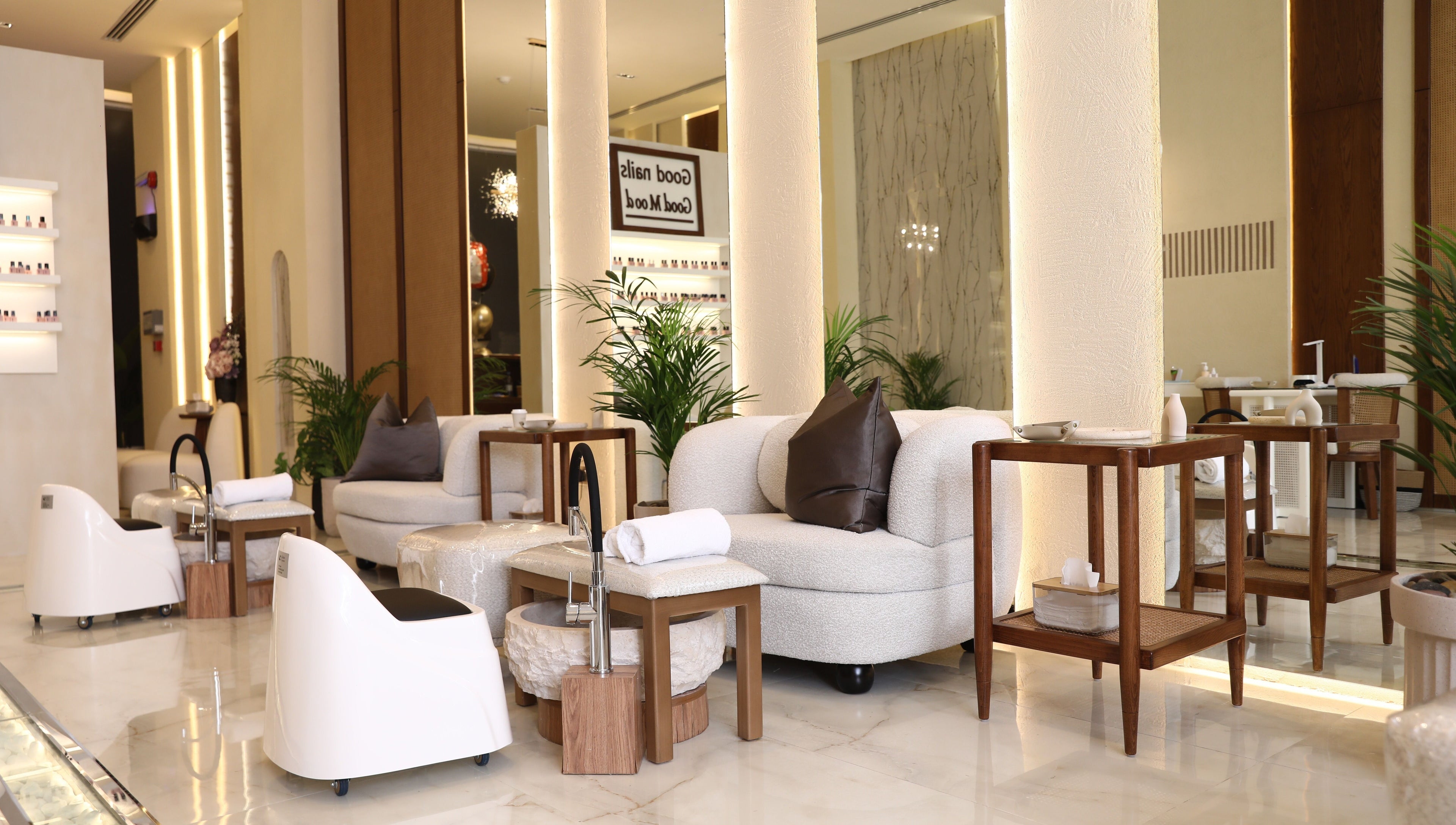 Chic interior at Nailsy, Riyadh, Riyadh Province, SA, showcasing plush seating and pedicure stations.