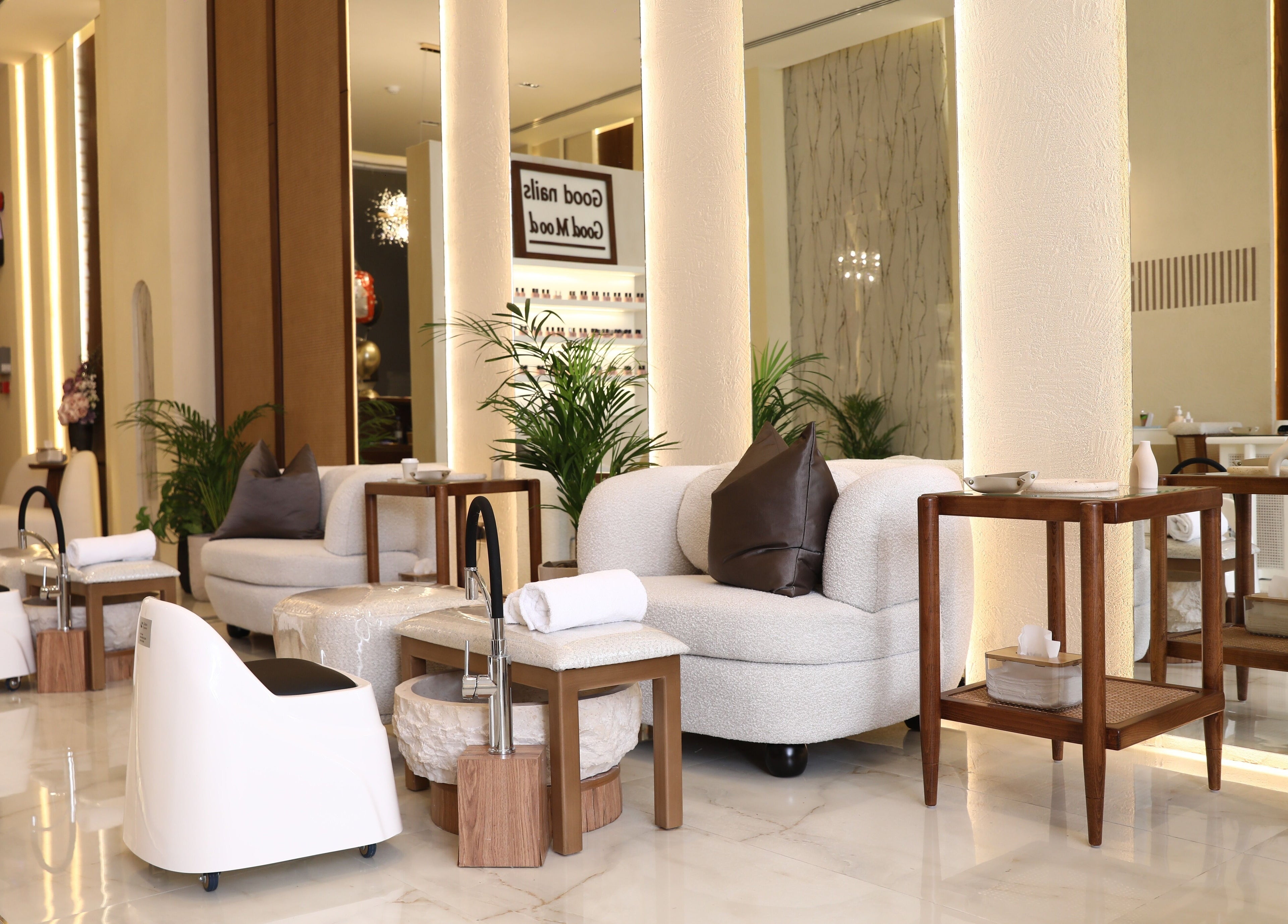 Chic interior at Nailsy, Riyadh, Riyadh Province, SA, showcasing plush seating and pedicure stations.