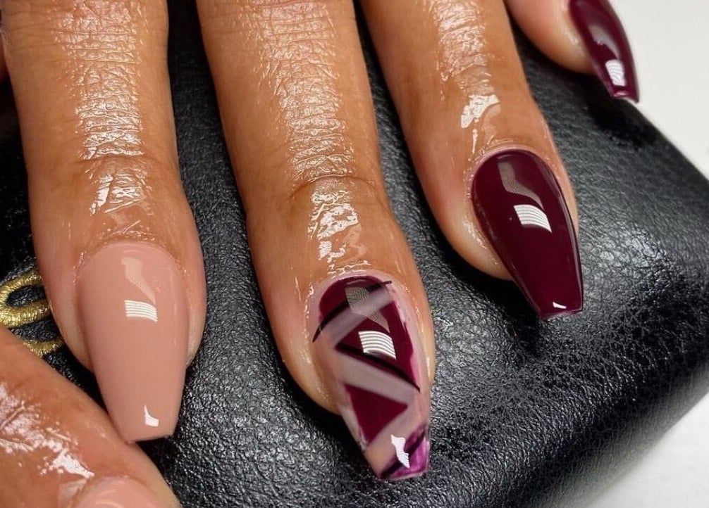Beautiful nail design at Cillah Nails in Cape Town, Western Cape, ZA with nude and burgundy shades.