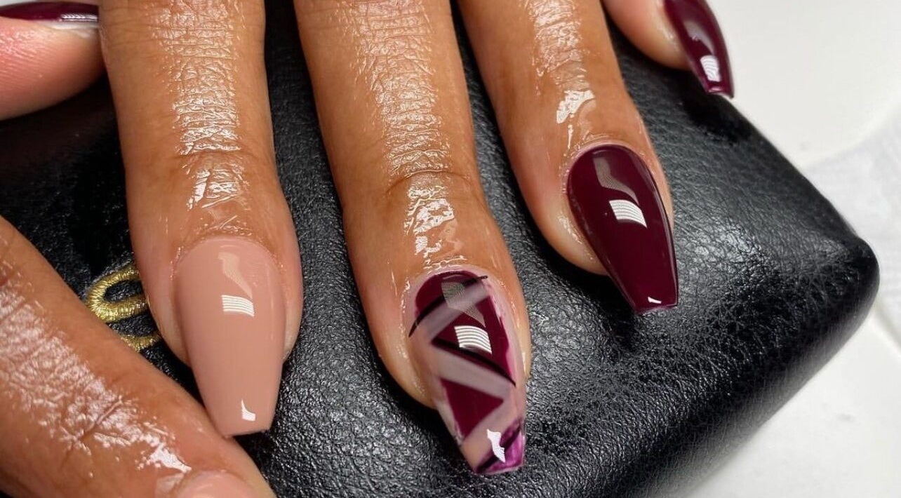 Beautiful nail design at Cillah Nails in Cape Town, Western Cape, ZA with nude and burgundy shades.