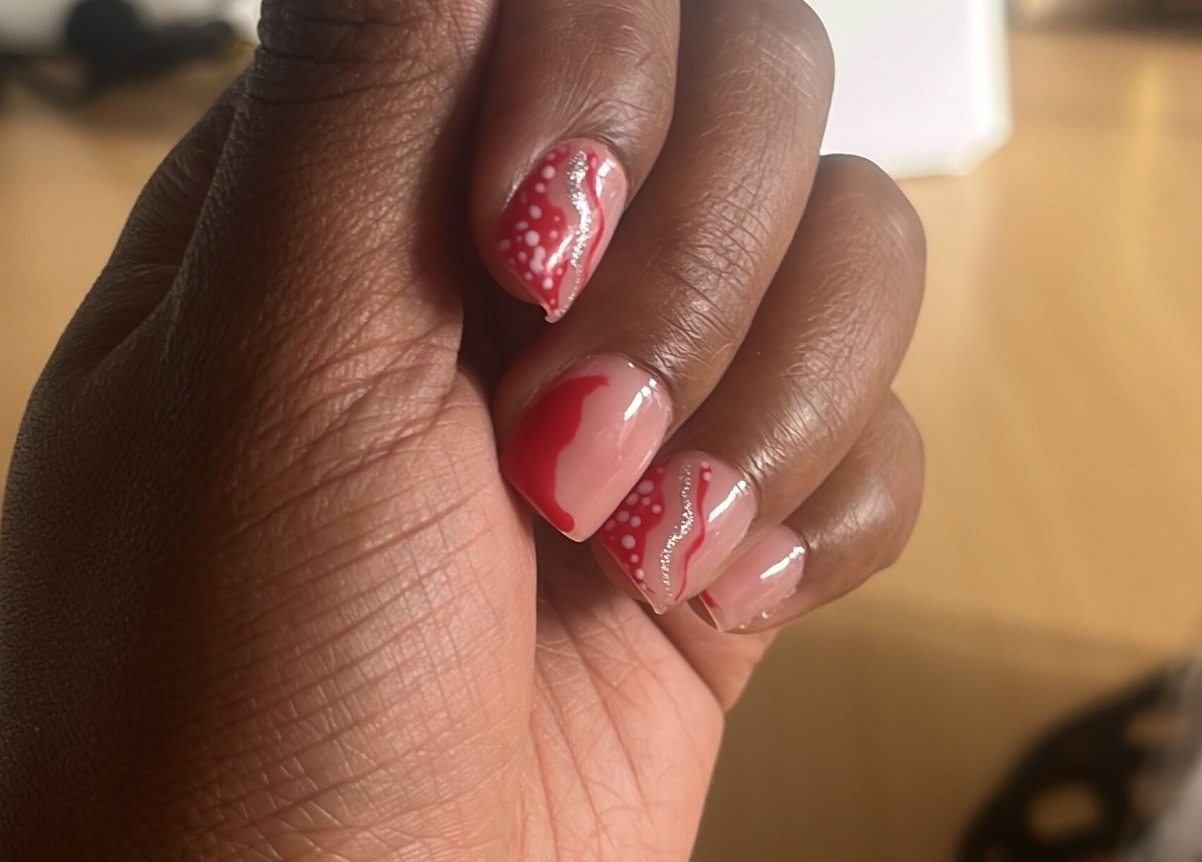 Beautiful nail art featuring red and white designs at Cillah Nails, Cape Town, Western Cape, ZA.