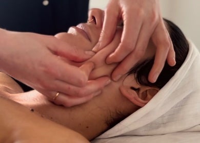 Facial massage at Adeline Peillet at East of Eden - Walthamstow E17, London, England, GB, promoting relaxation.