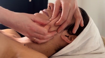 Facial massage at Adeline Peillet at East of Eden - Walthamstow E17, London, England, GB, promoting relaxation.