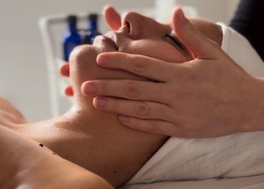 Relaxing facial massage at Adeline Peillet - Home Visit in London, England, GB. Gentle hands providing soothing care.