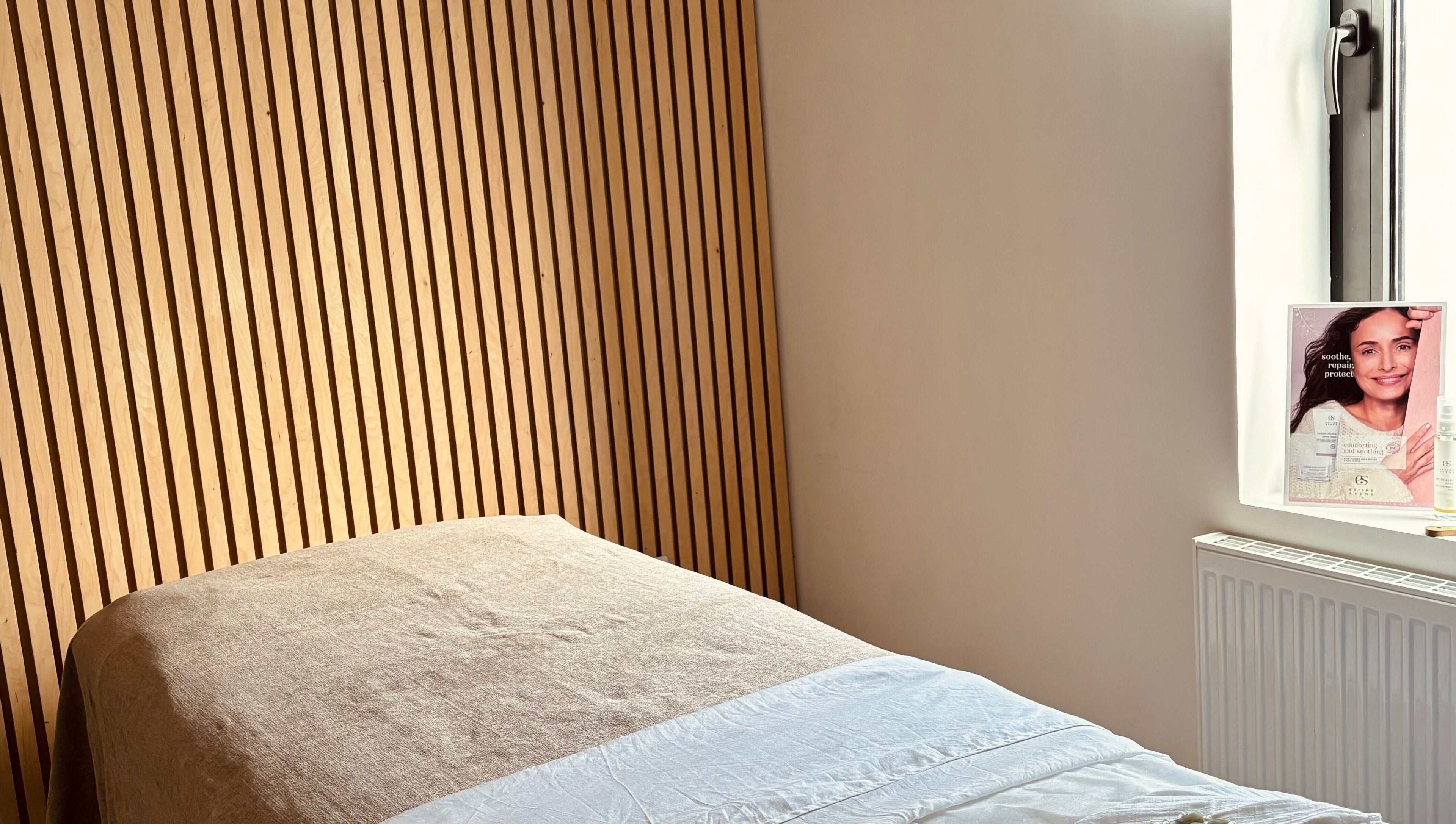 Calming treatment room at Adeline Peillet at East of Eden - Walthamstow E17, London, England, GB with wooden wall.