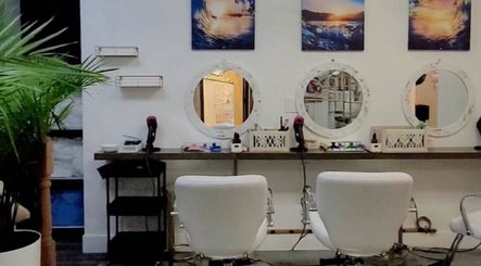 Chic salon styling stations with mirrors at Silky Headspa, San Jose, California, US.