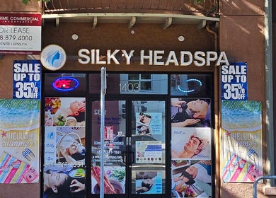 Front view of Silky Headspa entrance in San Jose, California, US showcasing vibrant posters and signage.