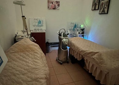 Cozy spa room at Silky Headspa, San Jose, California, US with massage tables and soft lighting.
