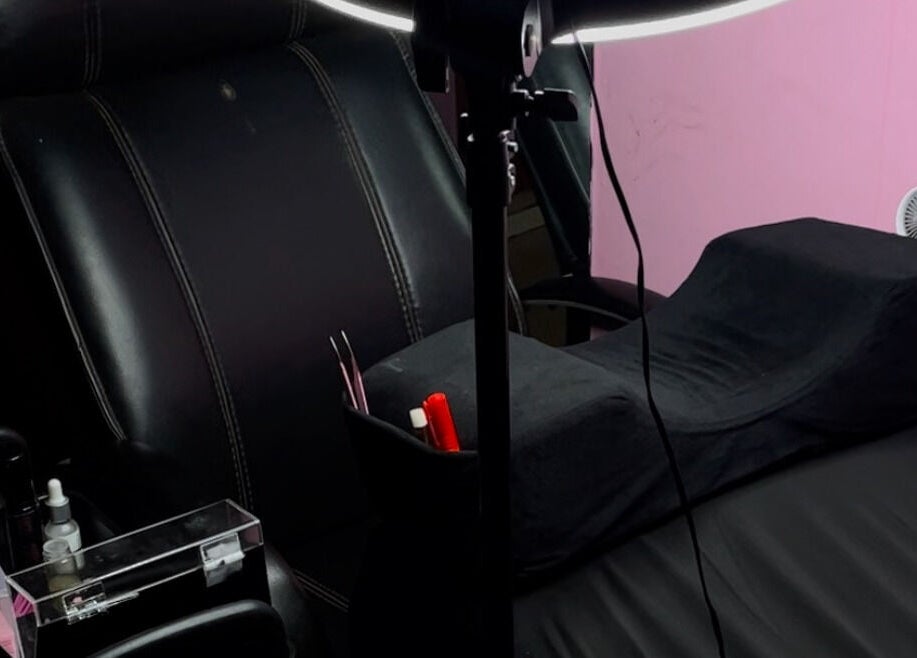 Cozy treatment room at Xaviera Aesthetics, Abuja, Federal Capital Territory, NG, with plush chairs and beauty tools.