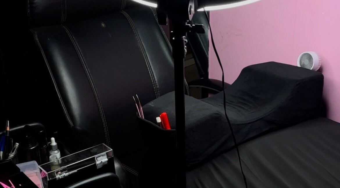 Cozy treatment room at Xaviera Aesthetics, Abuja, Federal Capital Territory, NG, with plush chairs and beauty tools.