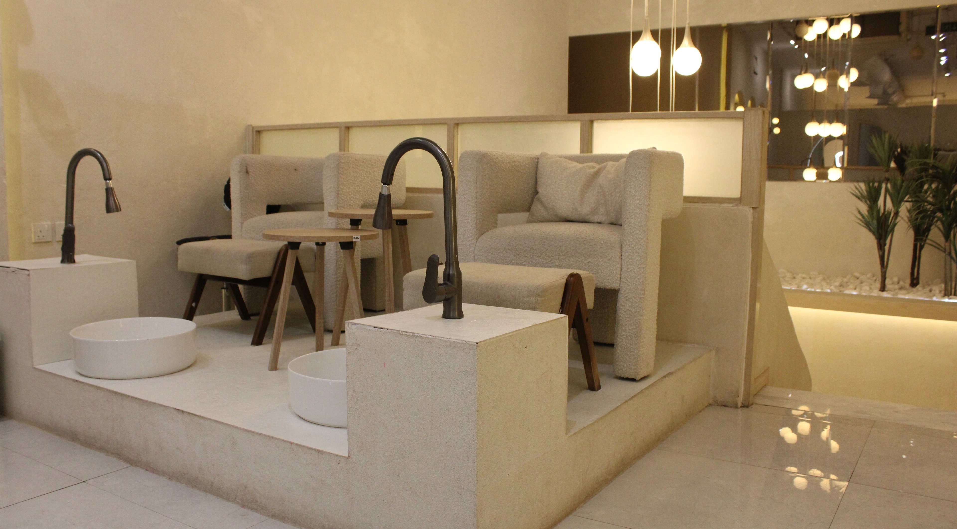 Luxurious pedicure area at Bloom, الرياض, منطقة الرياض, SA, featuring plush seating and soft lighting.