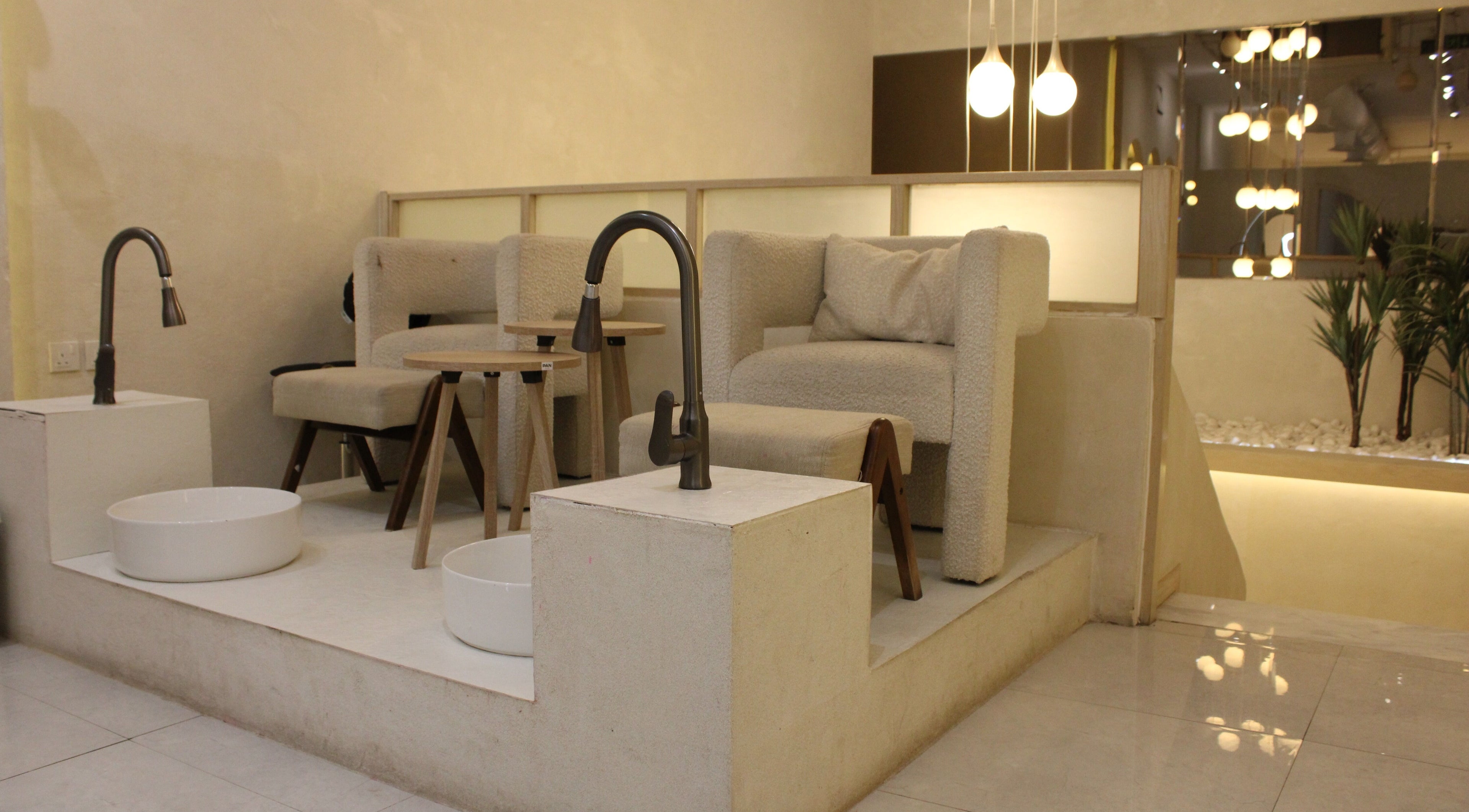 Luxurious pedicure area at Bloom, الرياض, منطقة الرياض, SA, featuring plush seating and soft lighting.