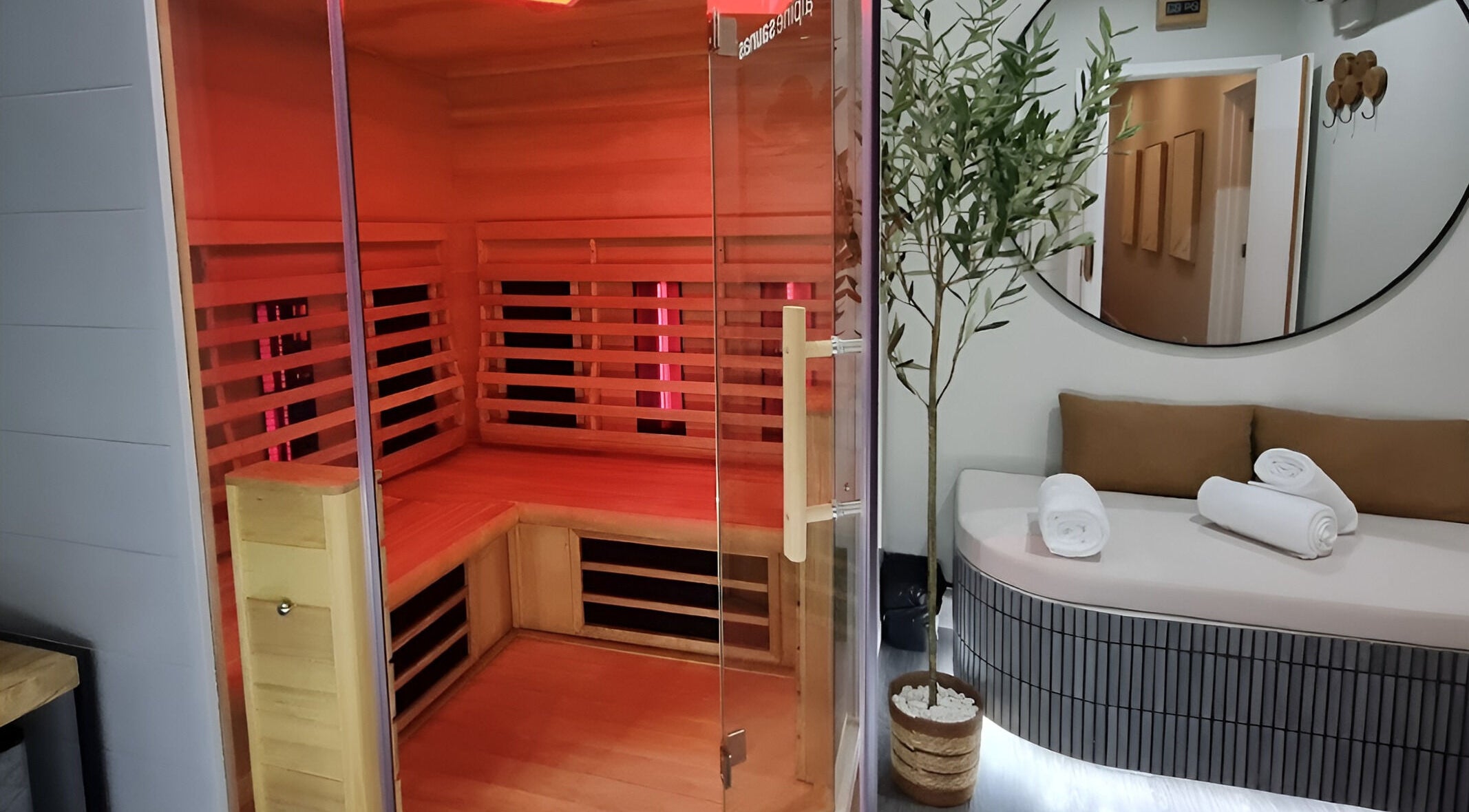 Luxurious sauna at Renew Wellness Place, Auckland, NZ, featuring a cozy wooden interior and relaxing ambiance.