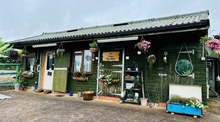 The Edgy Therapist @ The Holistic Hideaway in Broadclyst, England boasts a charming rustic exterior.