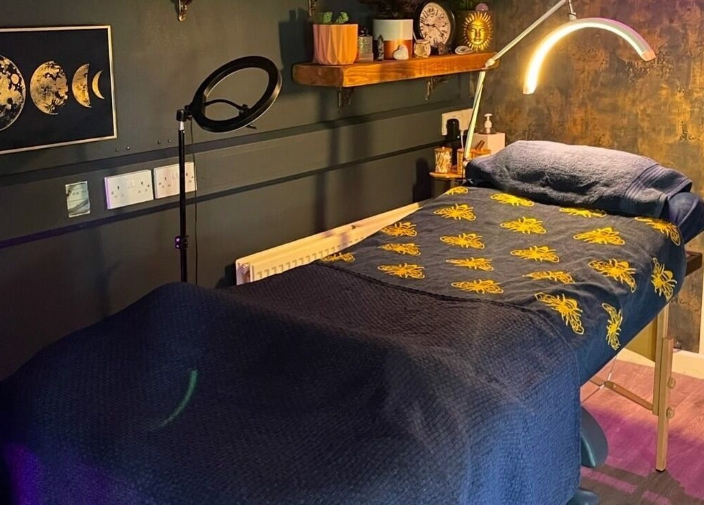 Relaxing therapy room at The Edgy Therapist @ The Holistic Hideaway, Broadclyst, England, GB with lunar artwork.