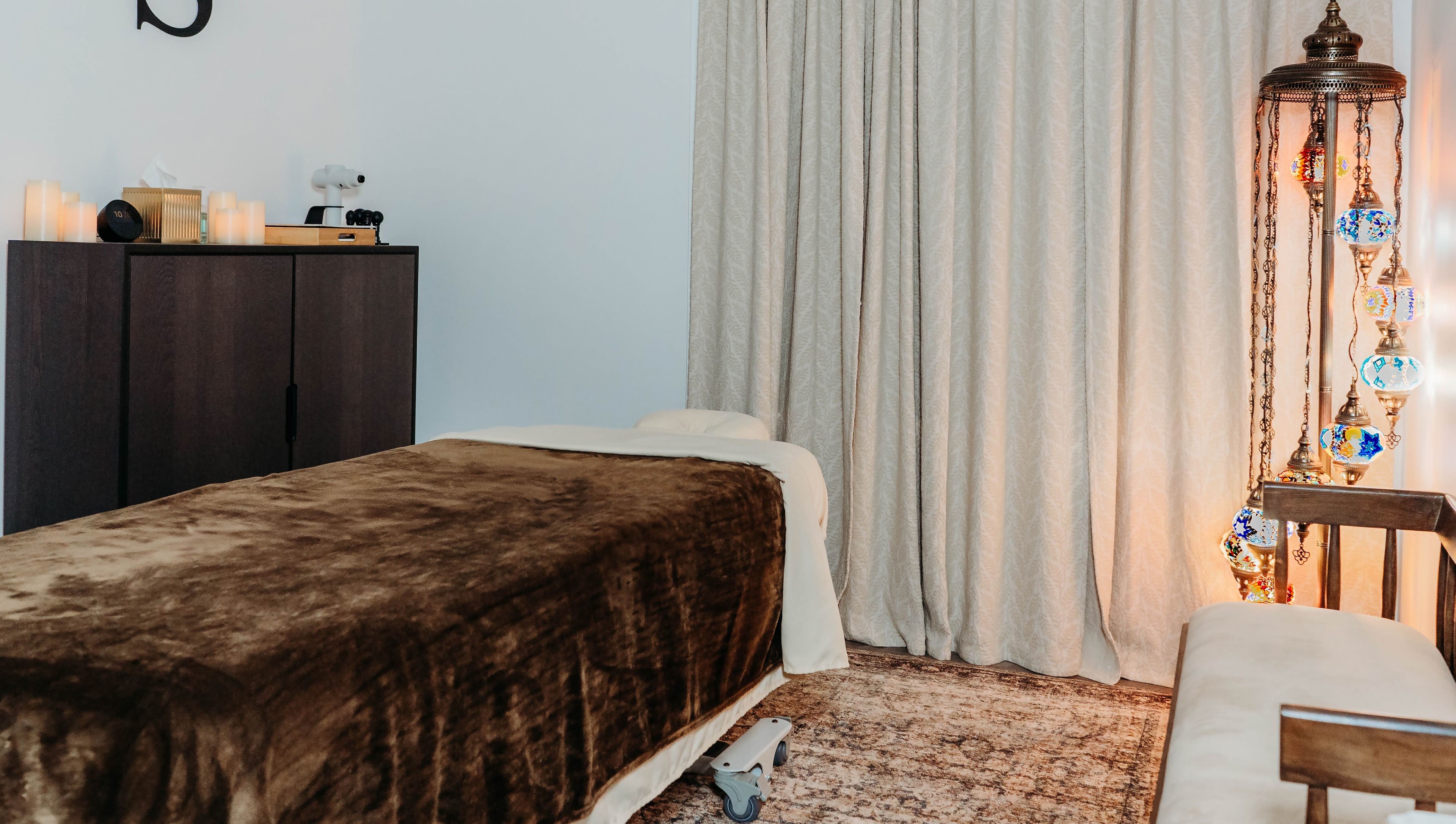 Relaxing massage room at Sol Massage Therapy, Hillsborough Township, New Jersey, US, featuring ambient lighting.