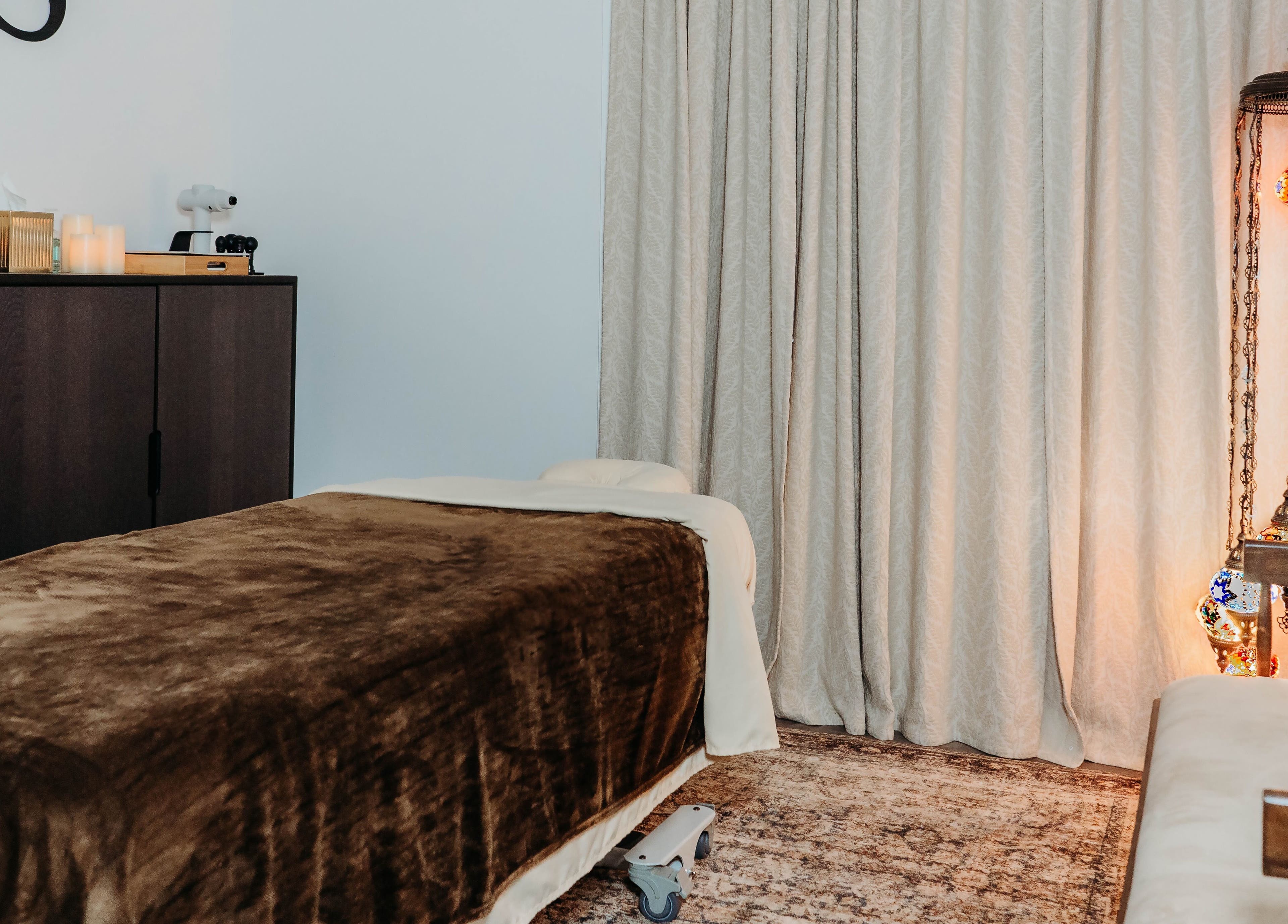 Relaxing massage room at Sol Massage Therapy, Hillsborough Township, New Jersey, US, featuring ambient lighting.