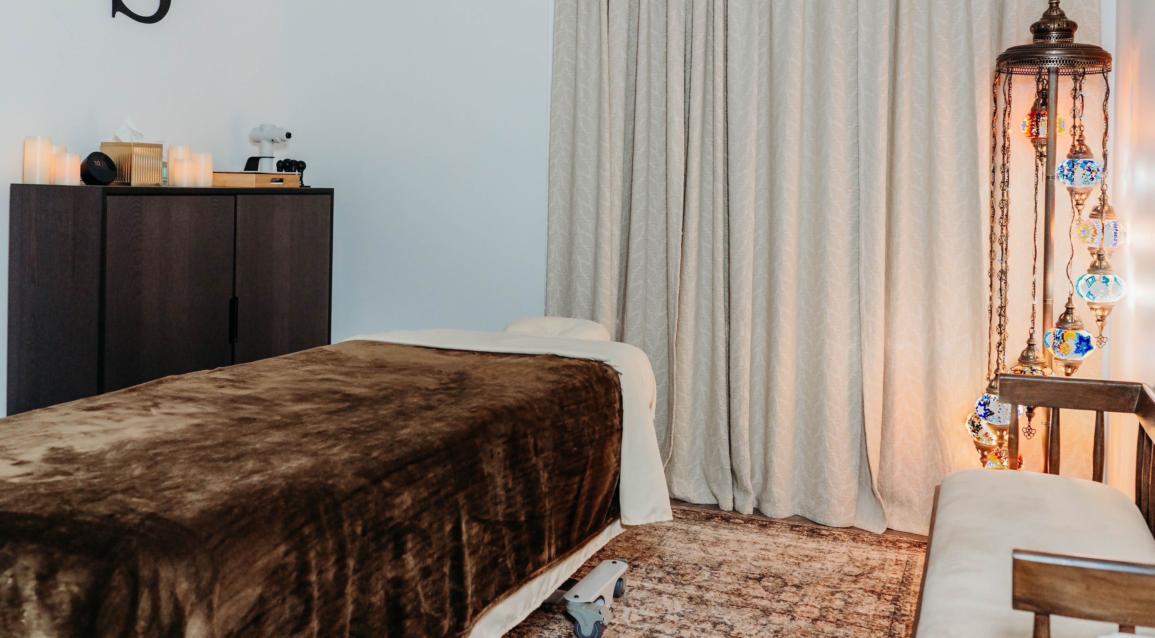 Relaxing massage room at Sol Massage Therapy, Hillsborough Township, New Jersey, US, featuring ambient lighting.