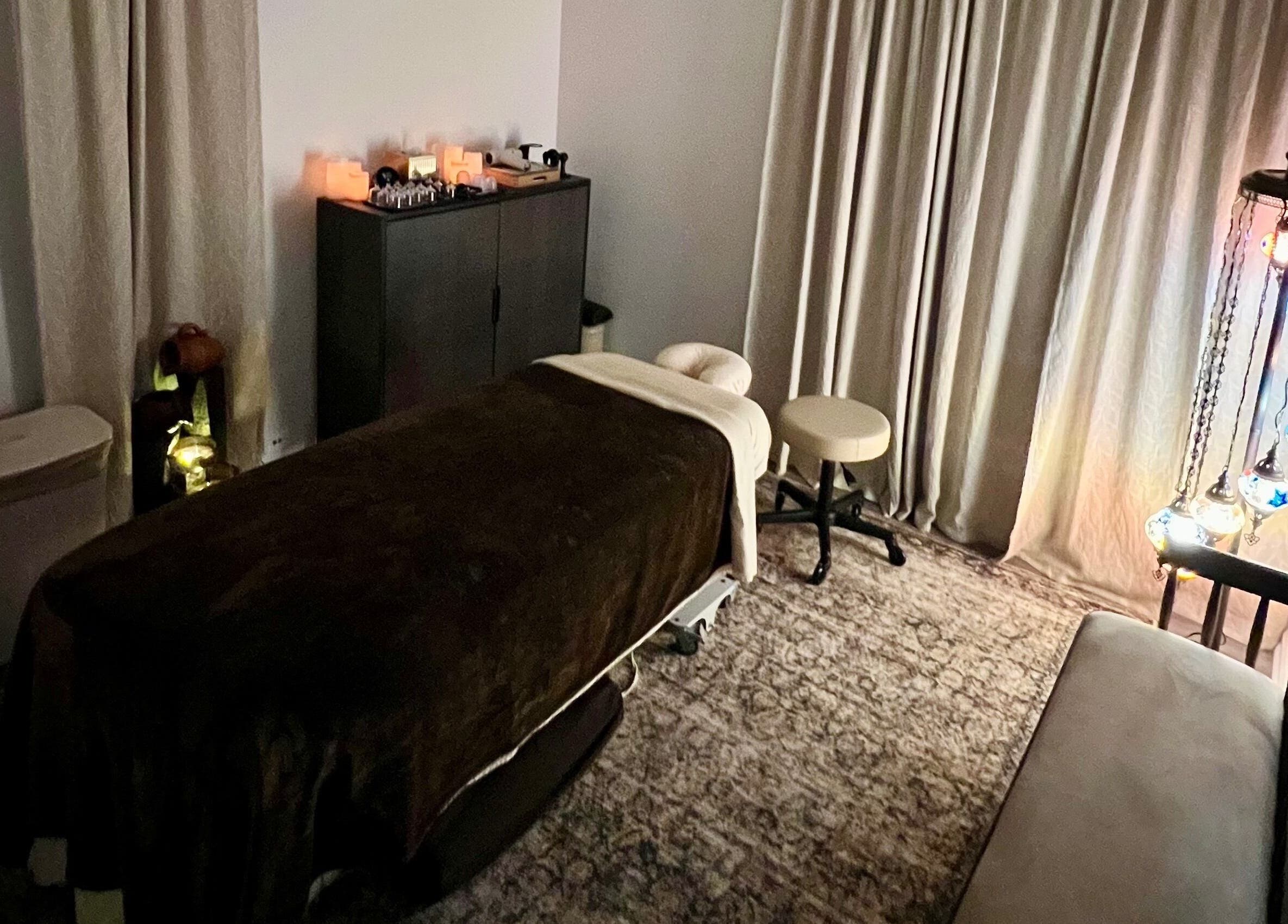 Relaxing massage room at Sol Massage Therapy in Hillsborough Township, New Jersey, US, with warm lighting.