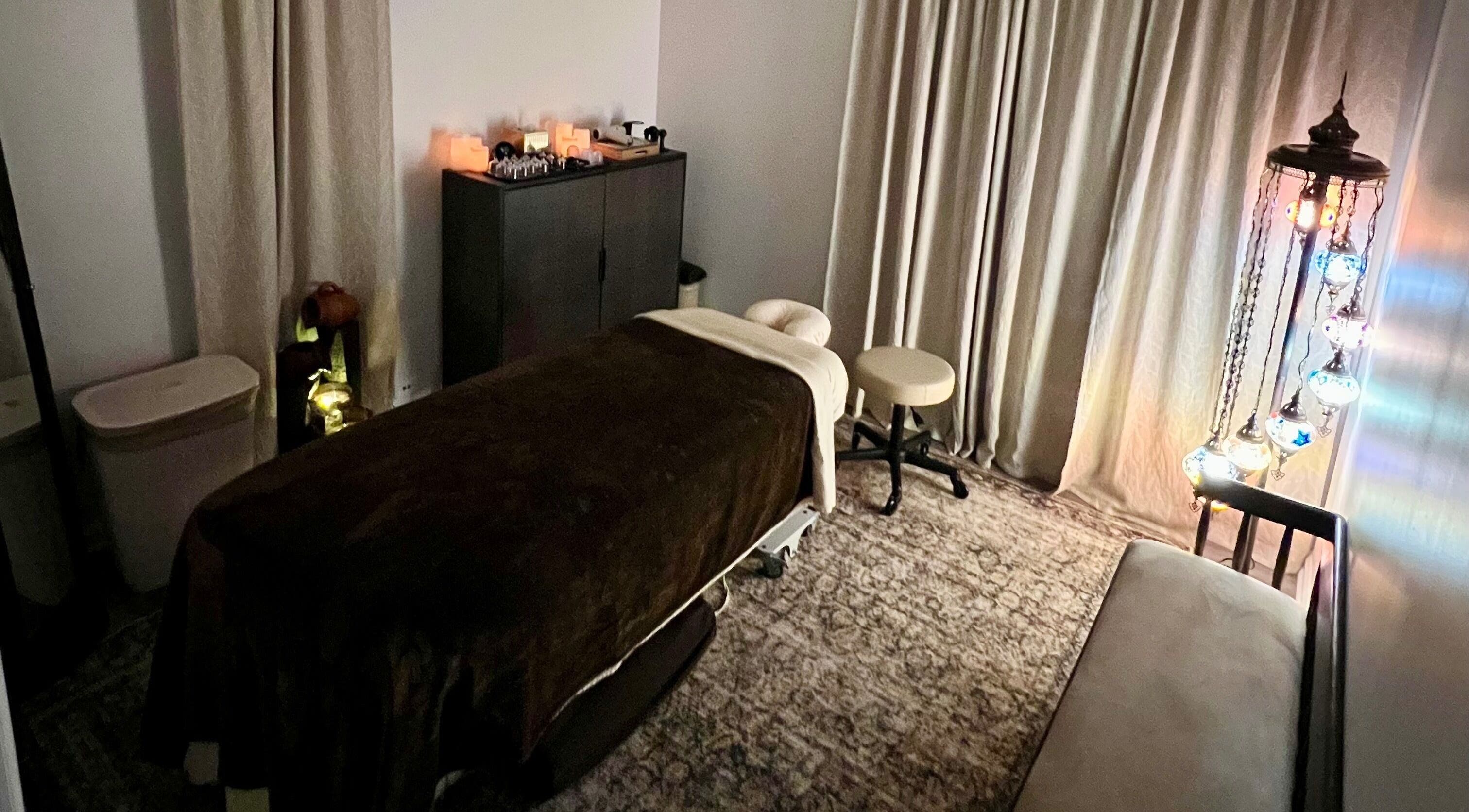 Relaxing massage room at Sol Massage Therapy in Hillsborough Township, New Jersey, US, with warm lighting.