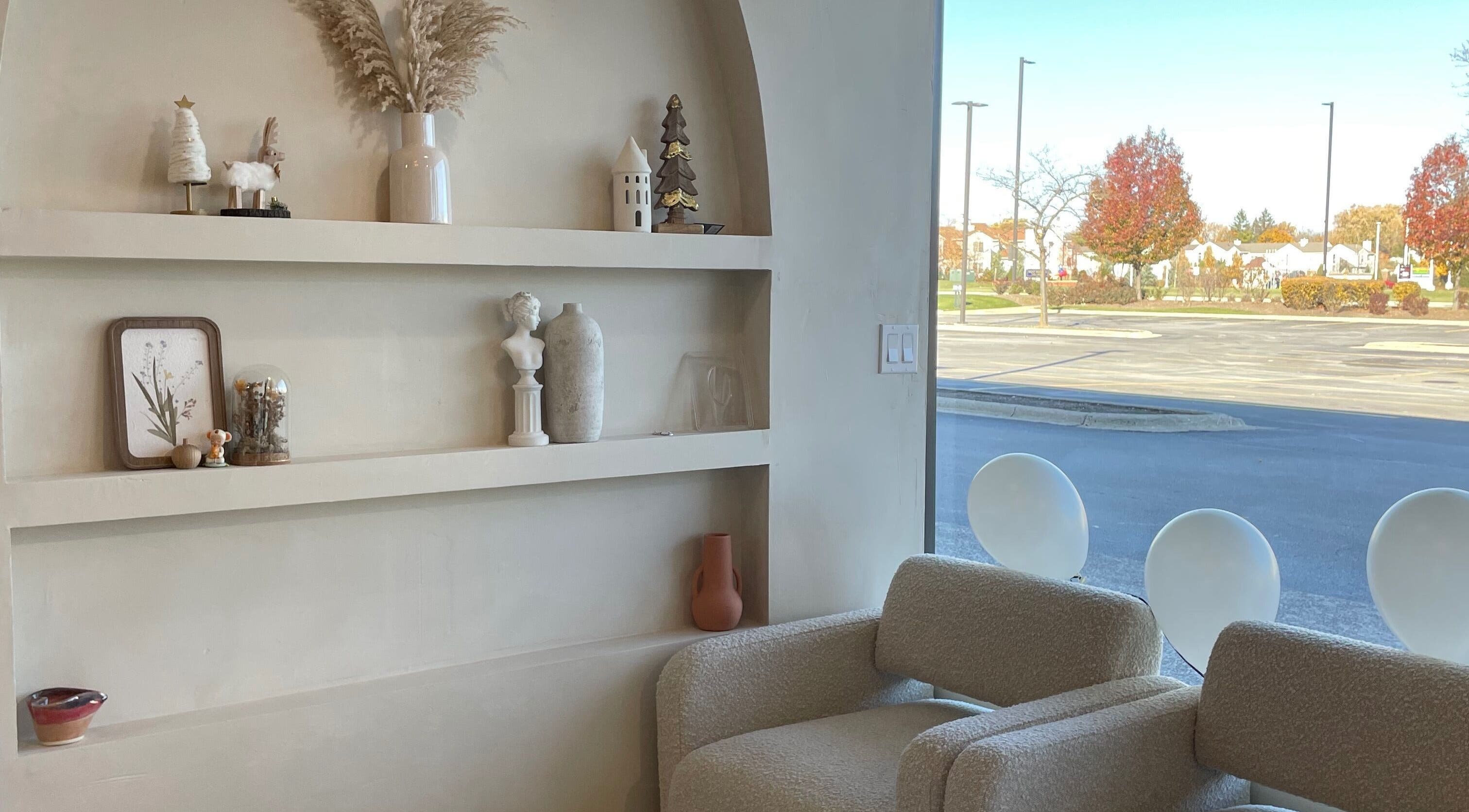 Elegant decor and seating at Àme Nail Lounge, Wheeling, Illinois, US, offering a welcoming atmosphere.
